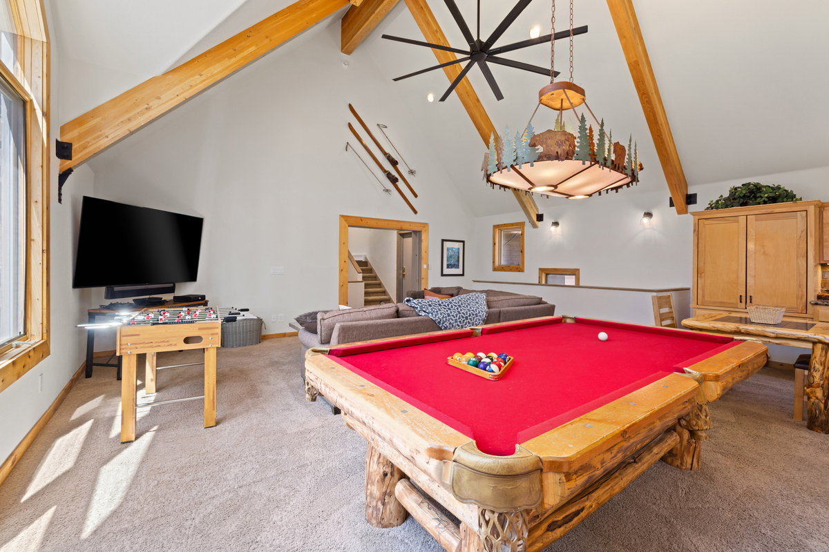 Living room #2 (Game Room) 75 Inch HDTV, Pool table, and foosball, and checkers