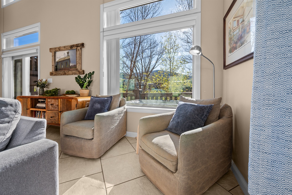 Sun-filled sitting area with mountain views and the perfect spot for morning coffee or evening conversation.