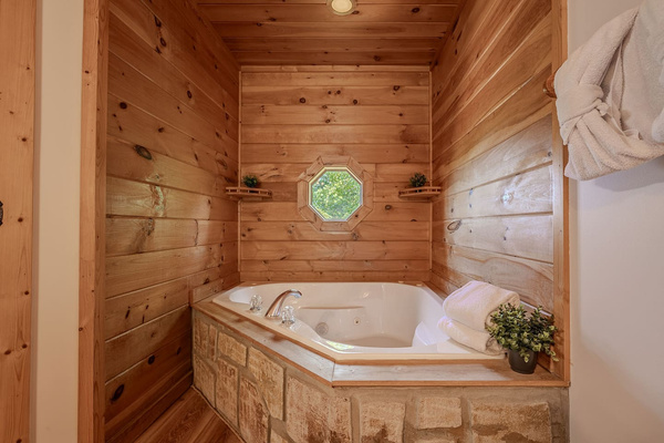 Relax and recharge in the oversized whirlpool tub attached to Master Bedroom.
