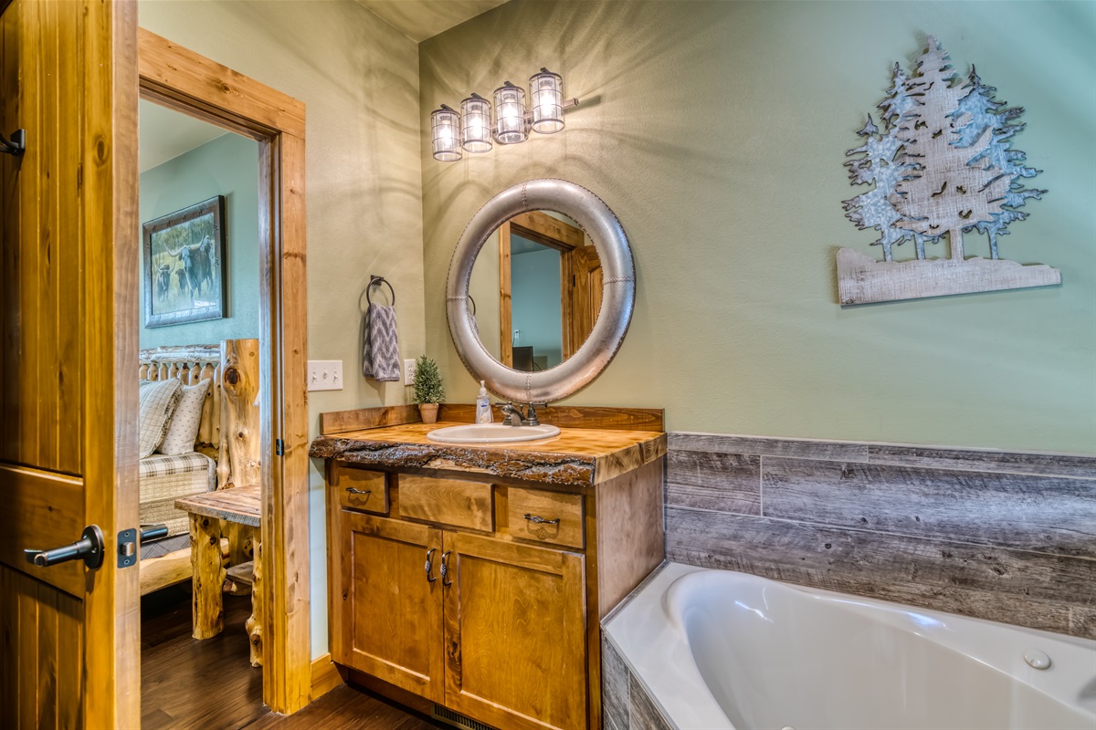 Main level bathroom with shower and jacuzzi tub