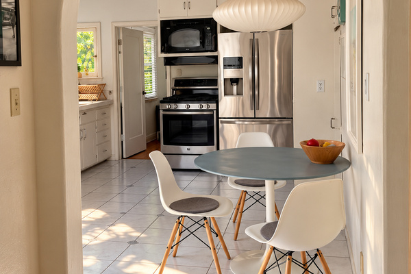 Arched doorway into the kitchen and breakfast nook.