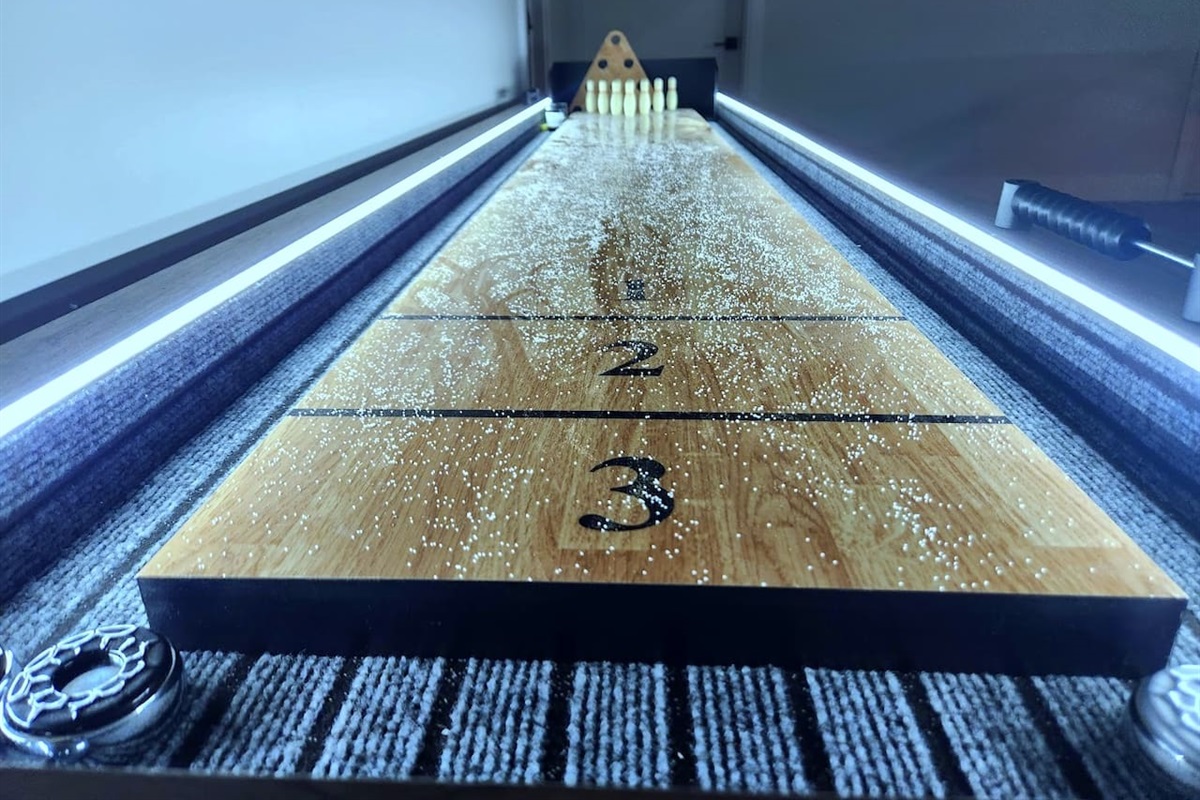 American Legend Shuffle board for endless fun , with bowling and LED lighting