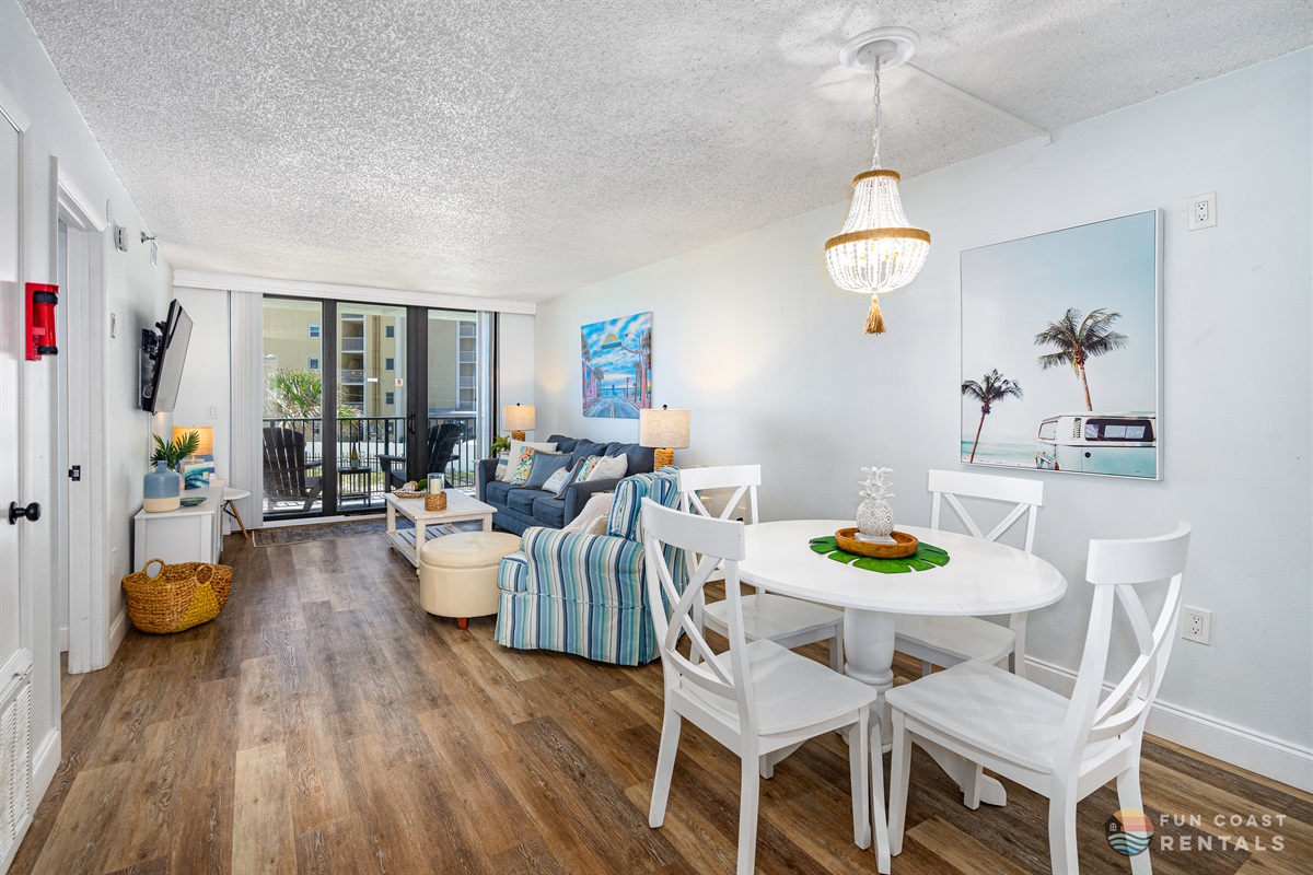 Spacious Living Room Area with 55" Smart TV and Dining Area