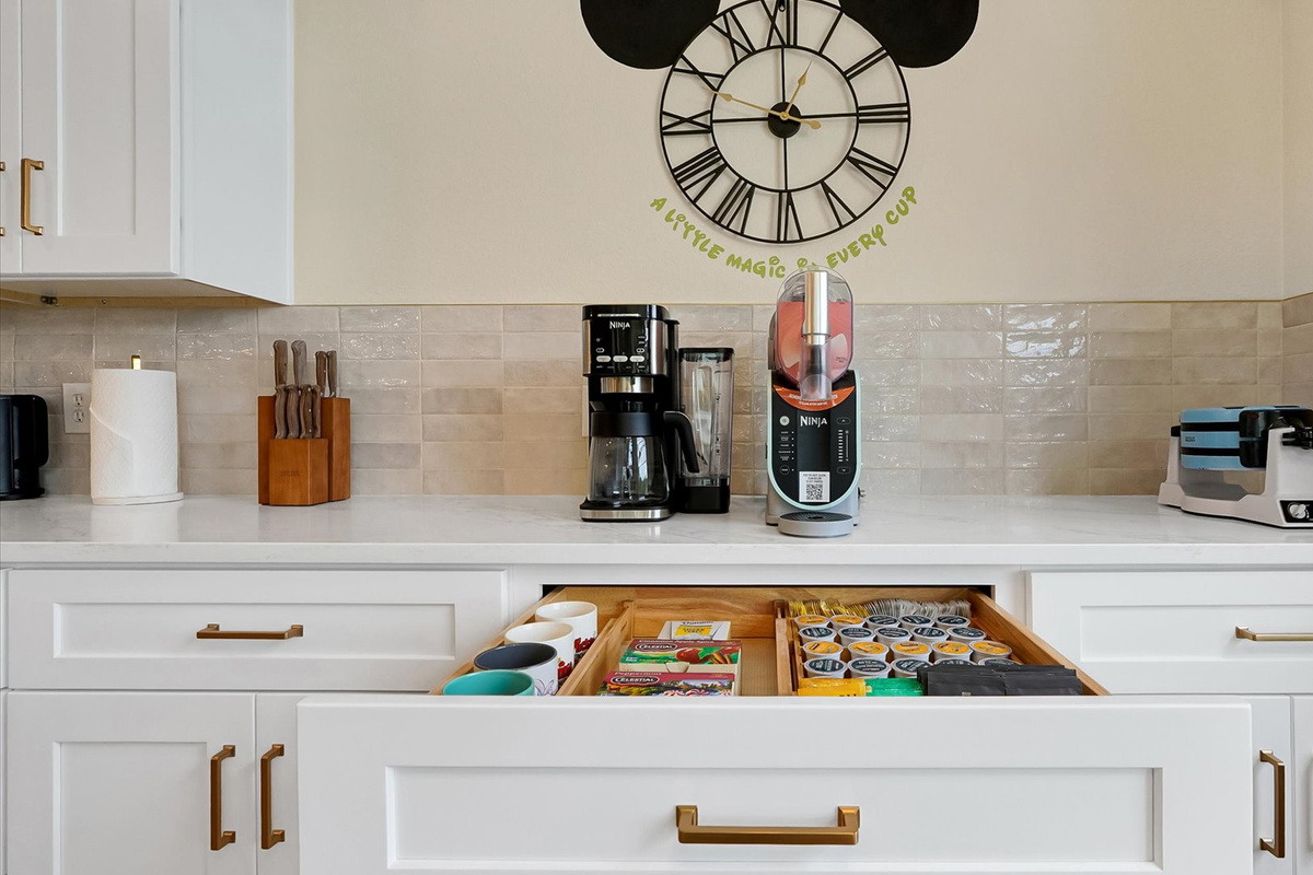 Coffee Bar: Dedicated coffee station with a Ninja coffee maker, frozen-drink machine, waffle maker and a selection of coffee and tea.