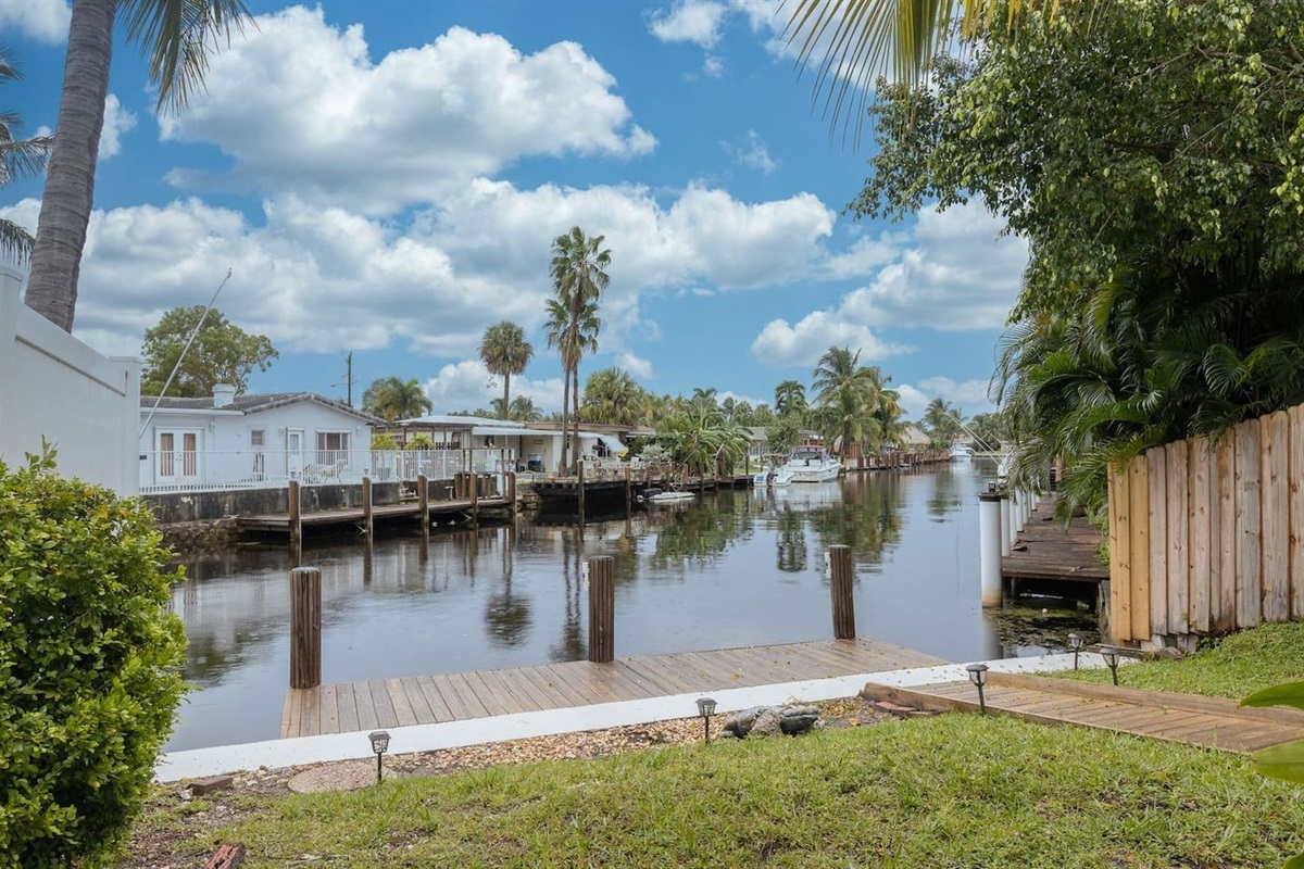 A vacation home with a water view! This Pompano waterway is called the "Bahama Canal". Enjoy paddleboarding, or fish off the 15-foot dock! Manatees are occasional visitors. Birdwatchers will enjoy the storks, herons, parrots, ibis and pelicans.