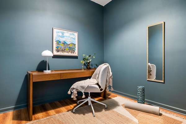 A quiet office nook off the primary suite—perfect for getting a little work done or rolling out the yoga mat to reset.