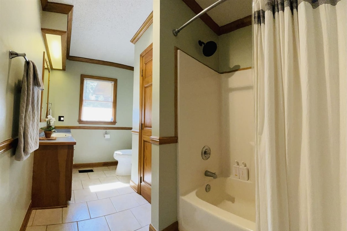 Main floor bath with a shower tub combo