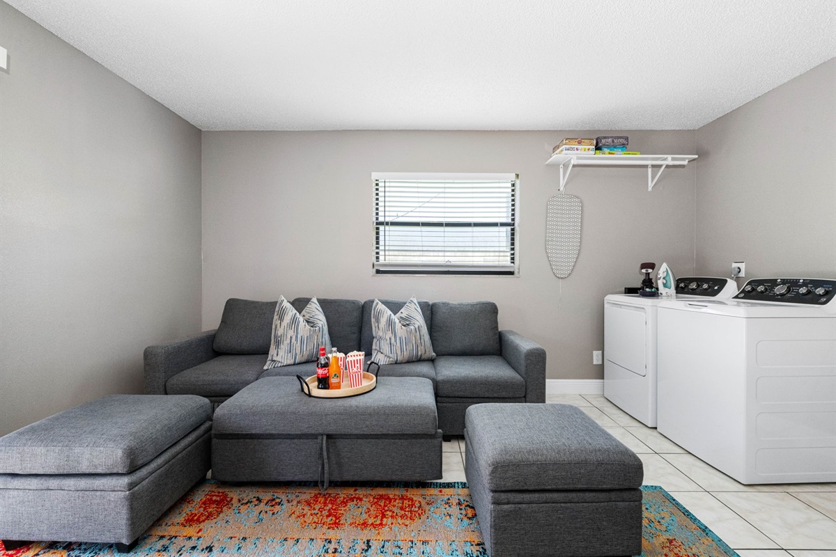 This flexible space is perfect for lounging, gaming, or getting a bit of work done. Enjoy the comfy sectional, retro arcade cabinet, and convenient in-unit washer and dryer.