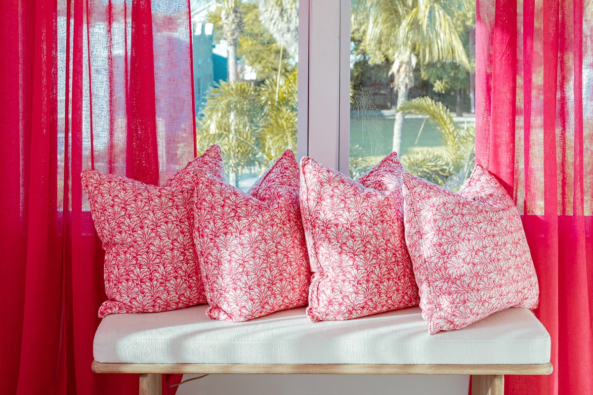 The third bedroom has themes of Palm Beach in pink and red, a stylish and fun way to be immersed in the local culture.