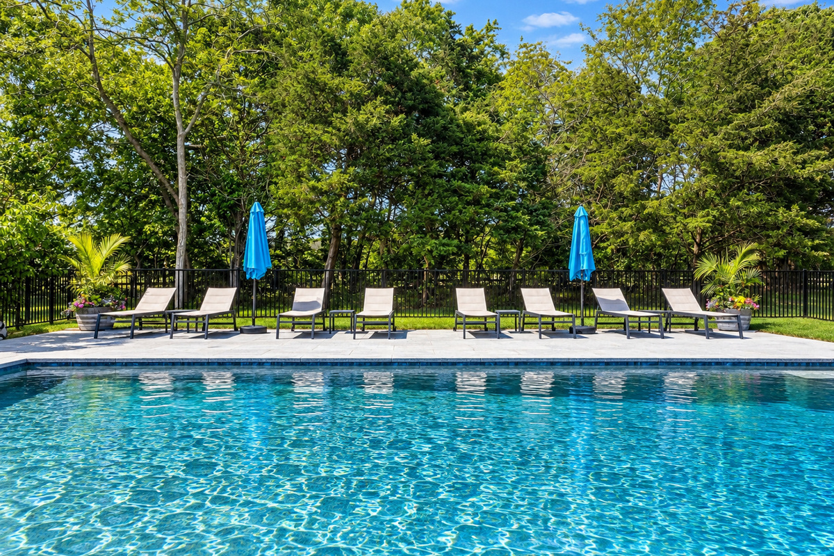 Pool with lounge chairs and umbrellas
