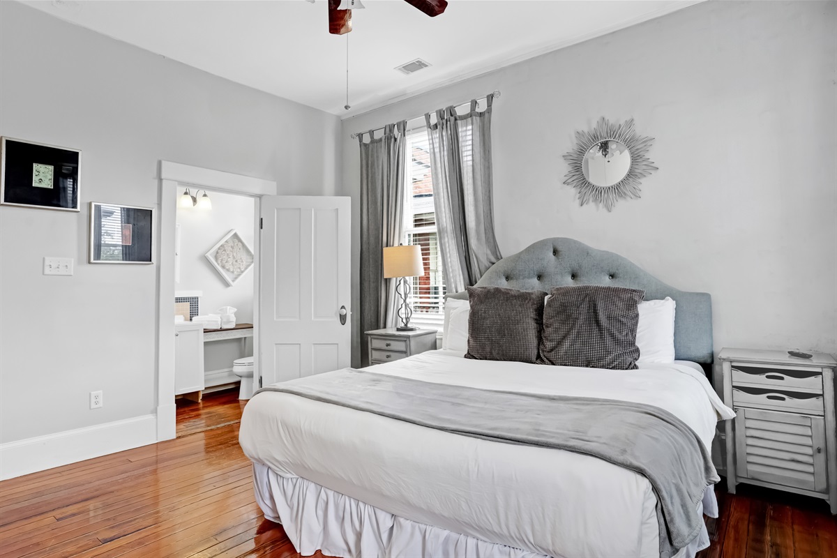 Spacious primary bedroom with a luxurious king bed for ultimate comfort.