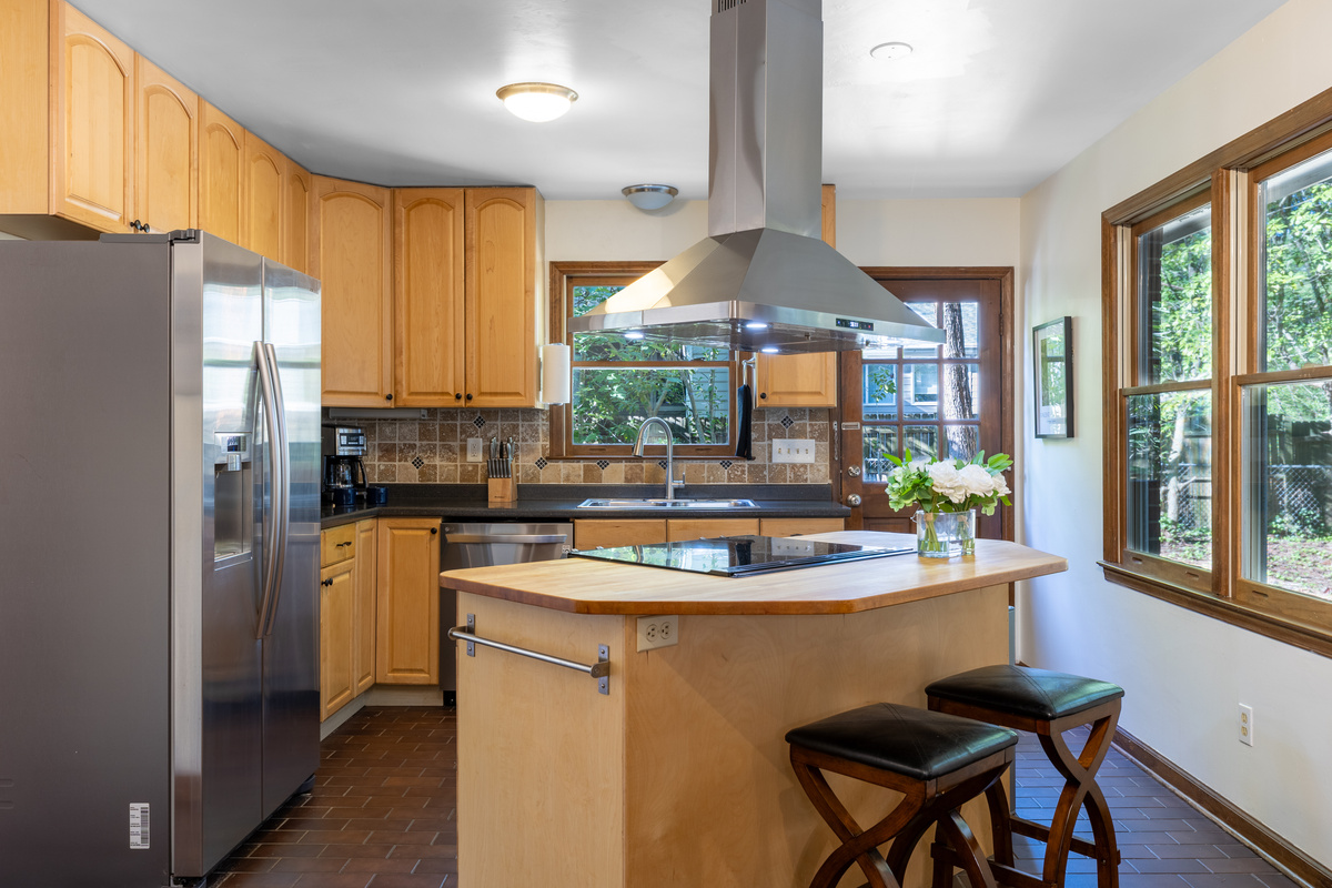 The kitchen has bar seating as well as a high top table. 