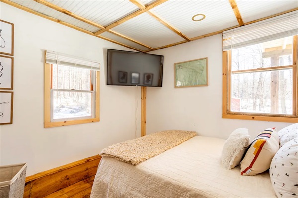 Both downstairs bedrooms have smart TVs and are bathed in natural light - just like the rest of the cabin!