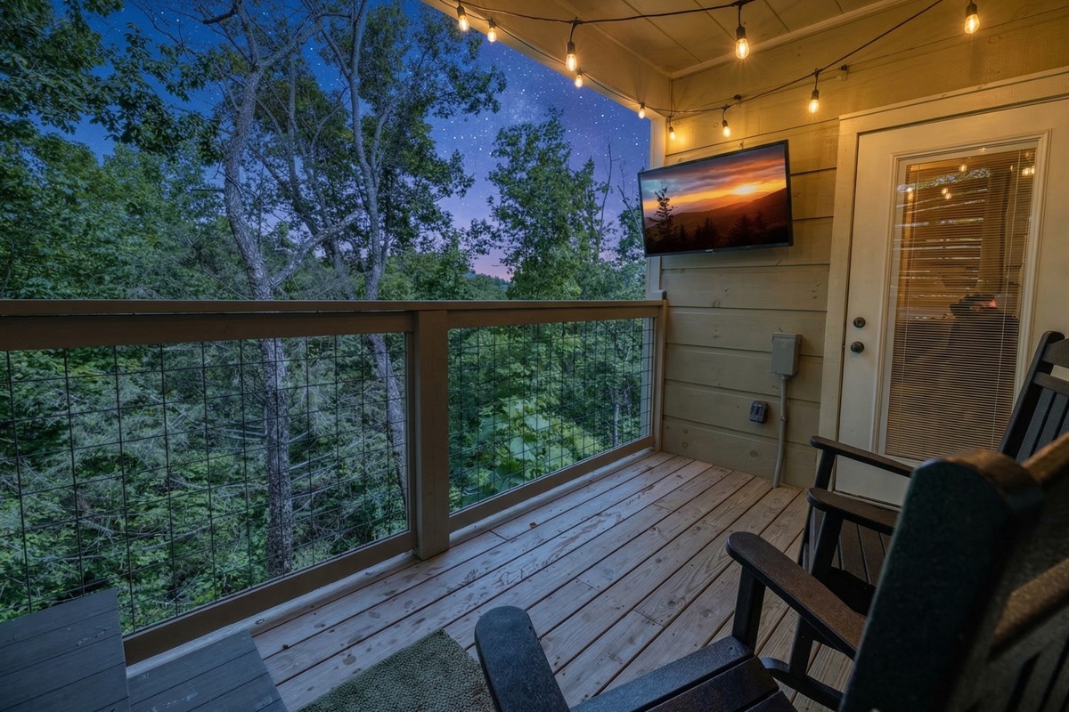 Take the living room outside on the back porch at Marigold Cabin in Pigeon Forge, TN. Complete with an outdoor TV and comfortable seating, this covered porch is the ultimate spot to watch the big game, catch a movie under the stars.