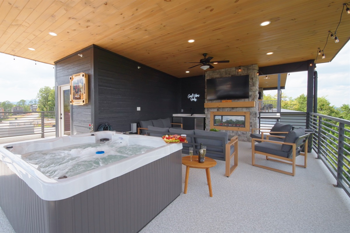 Private rooftop terrace with hot tub, fireplace, and breathtaking sunrise + mountain views.