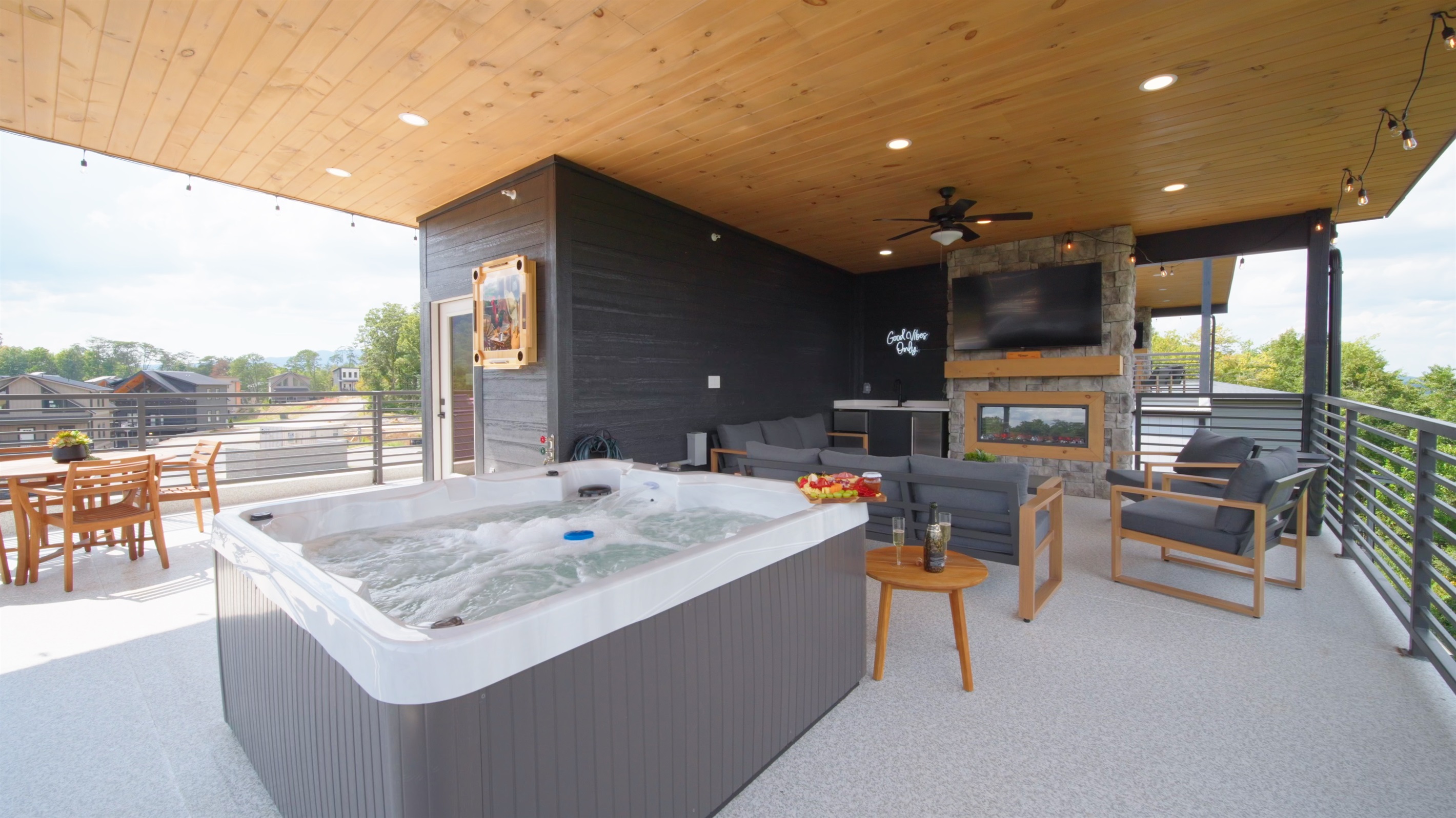 Private rooftop terrace with hot tub, fireplace, and breathtaking sunrise + mountain views.