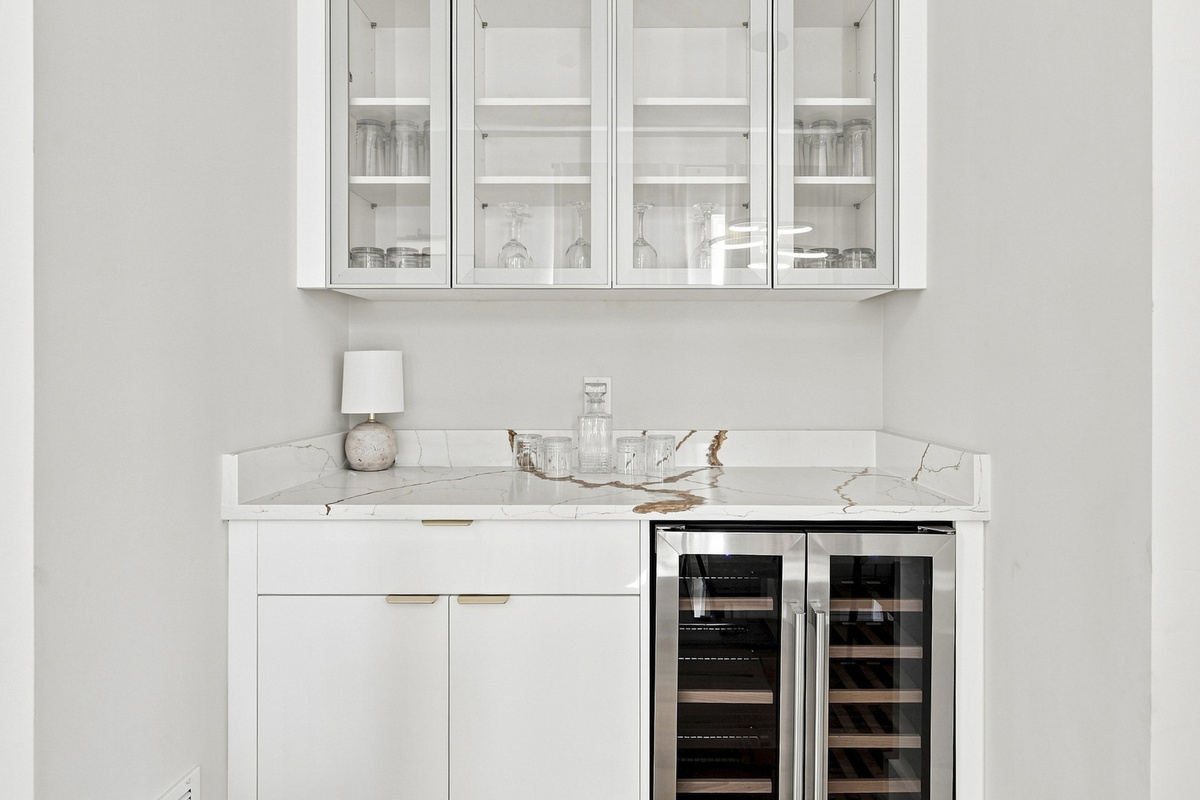 Stylish marble countertop and sleek cabinetry await your cocktail creations!
