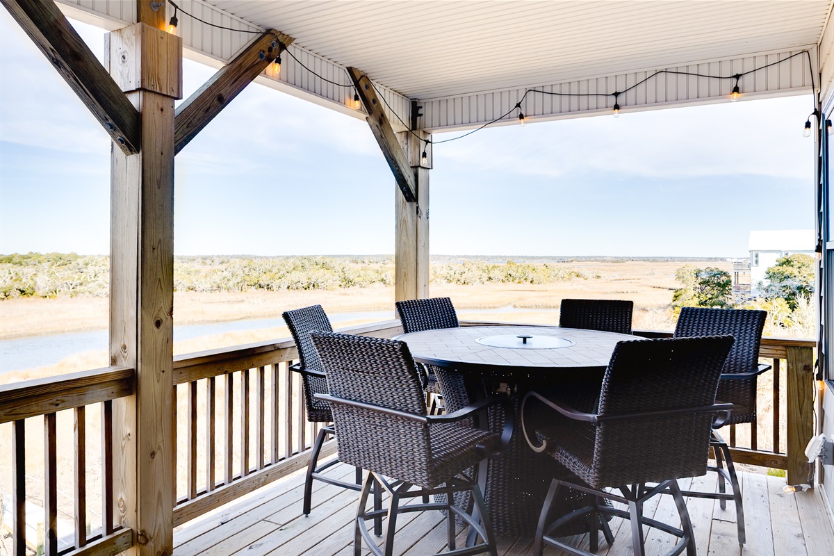 Welcome to Surf City Sunsets! Outdoor dining with sweeping Sound scenery&mdash;perfect for meals, games, or sunset drinks