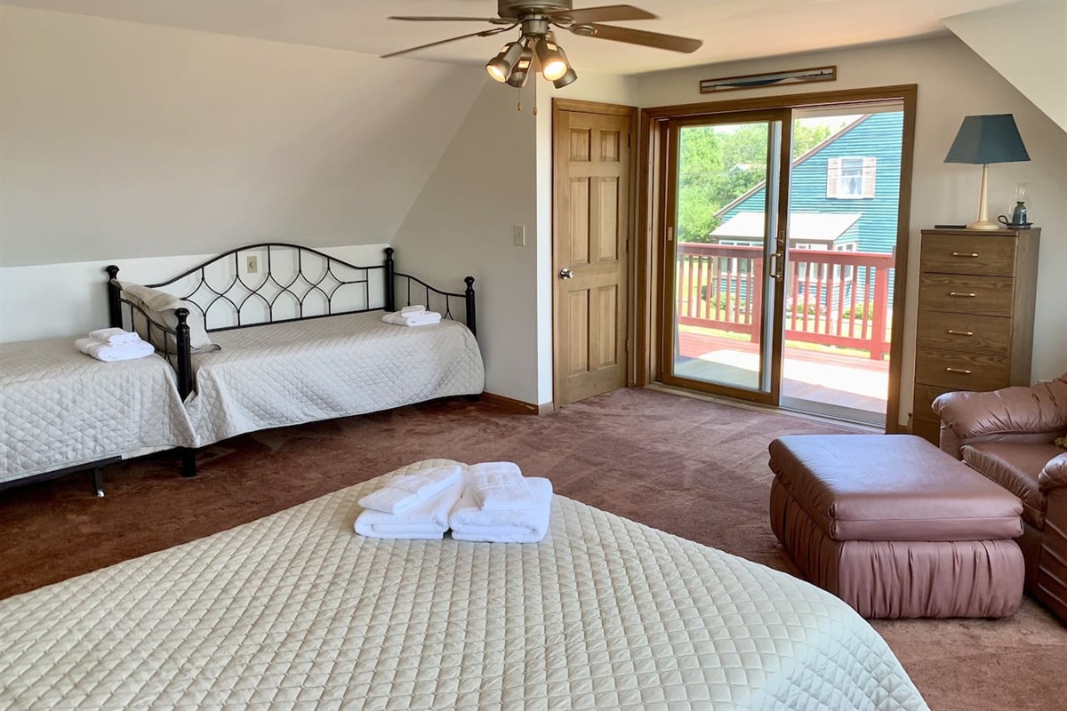 First bedroom with full bed as well as two twins...also enjoy the balcony for a nice cup of coffee as well as the sunrise!