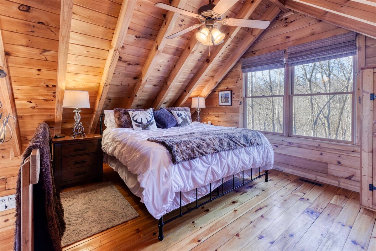 The king bed in the loft overlooks the living area.  Full bathroom is off the king bed loft. There is a TV in the room as well to watch from the bed if you like as well as a small closet for hanging clothes.  Robes are also provided.