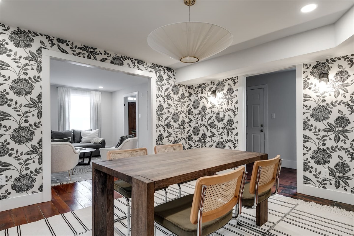 Dining Room: Delight in floral elegance and gather around the rustic table for memorable meals!