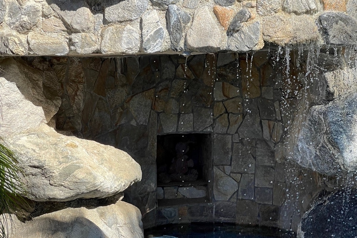 Swim behind the waterfall into the grotto