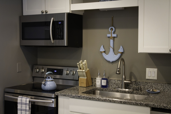 Closer view of the stove and sink