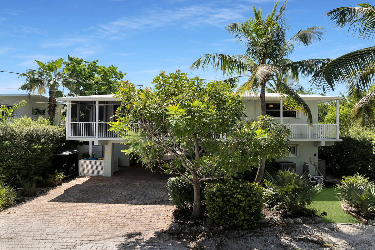 Front view of home. Parking for 2 vehicles and boat trailer.