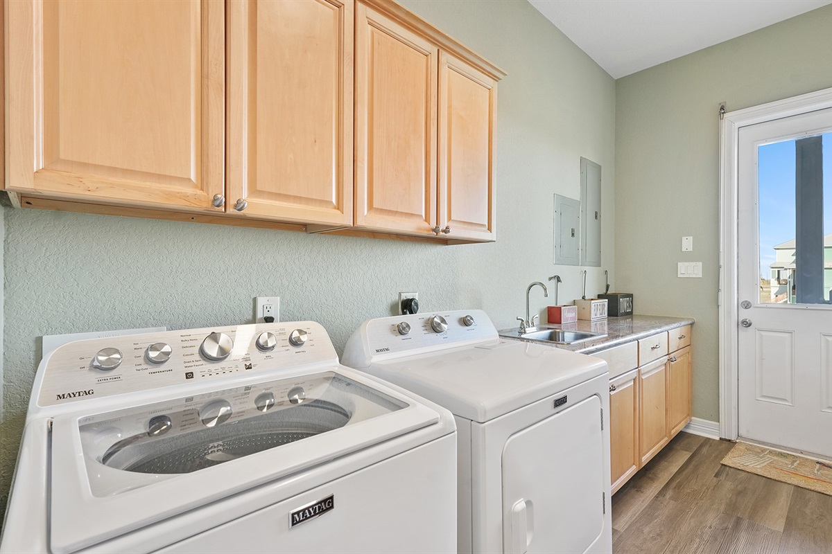 Laundry is covered with a full size washer and dryer.