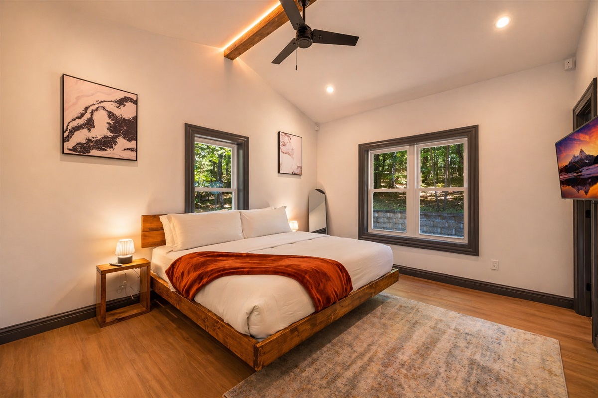 Comfy, cozy king sized bed in the primary bedroom with ensuite bathroom.