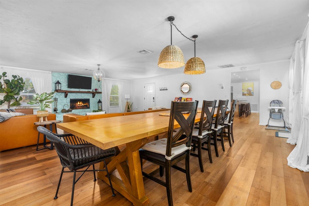 Newly decorated! Huge boho themed living room with 12-foot long custom dining table.