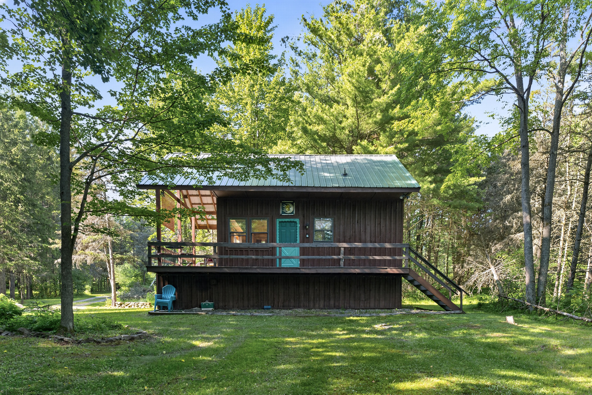 Front exterior with surrounding lawn