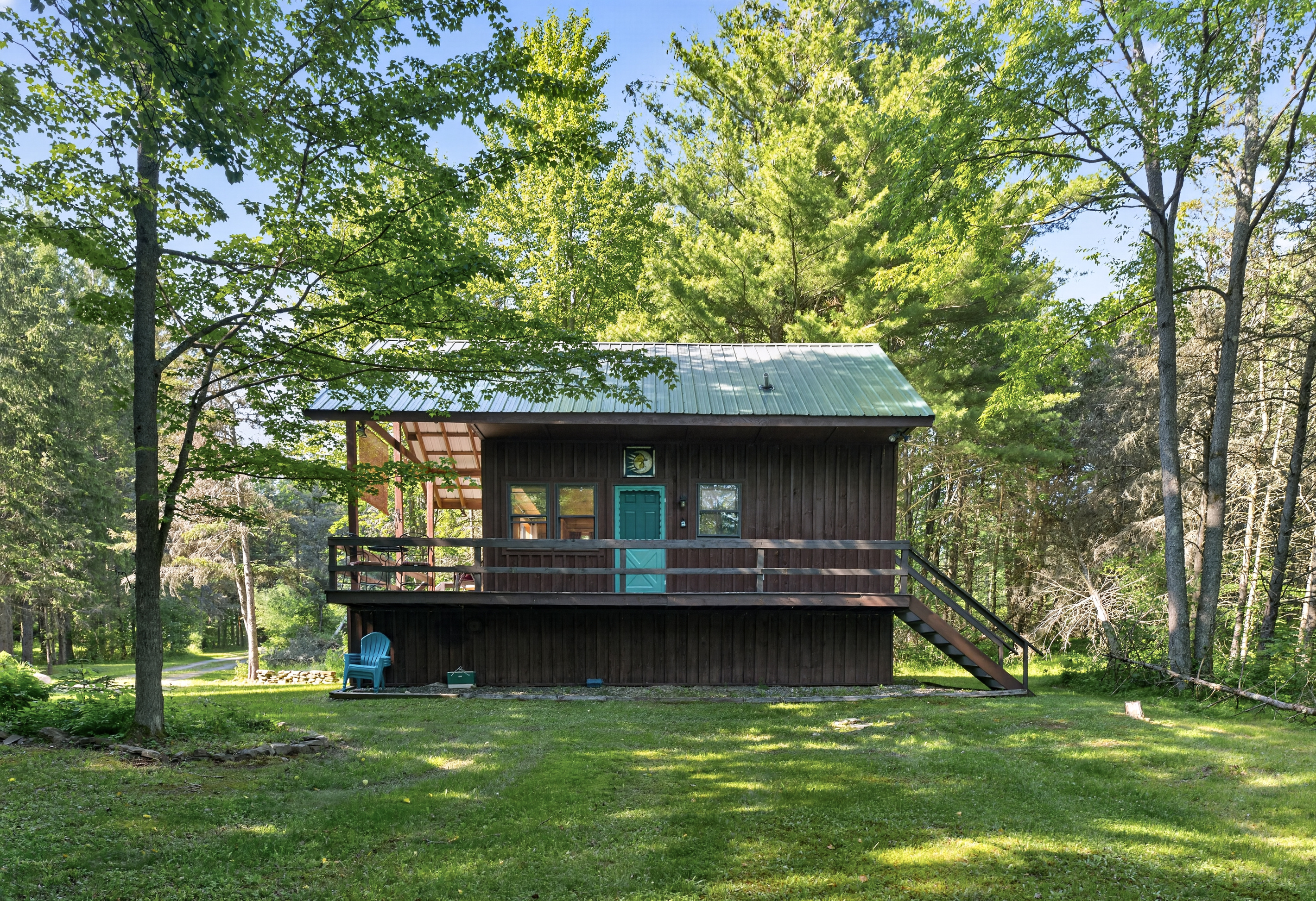 Front exterior with surrounding lawn