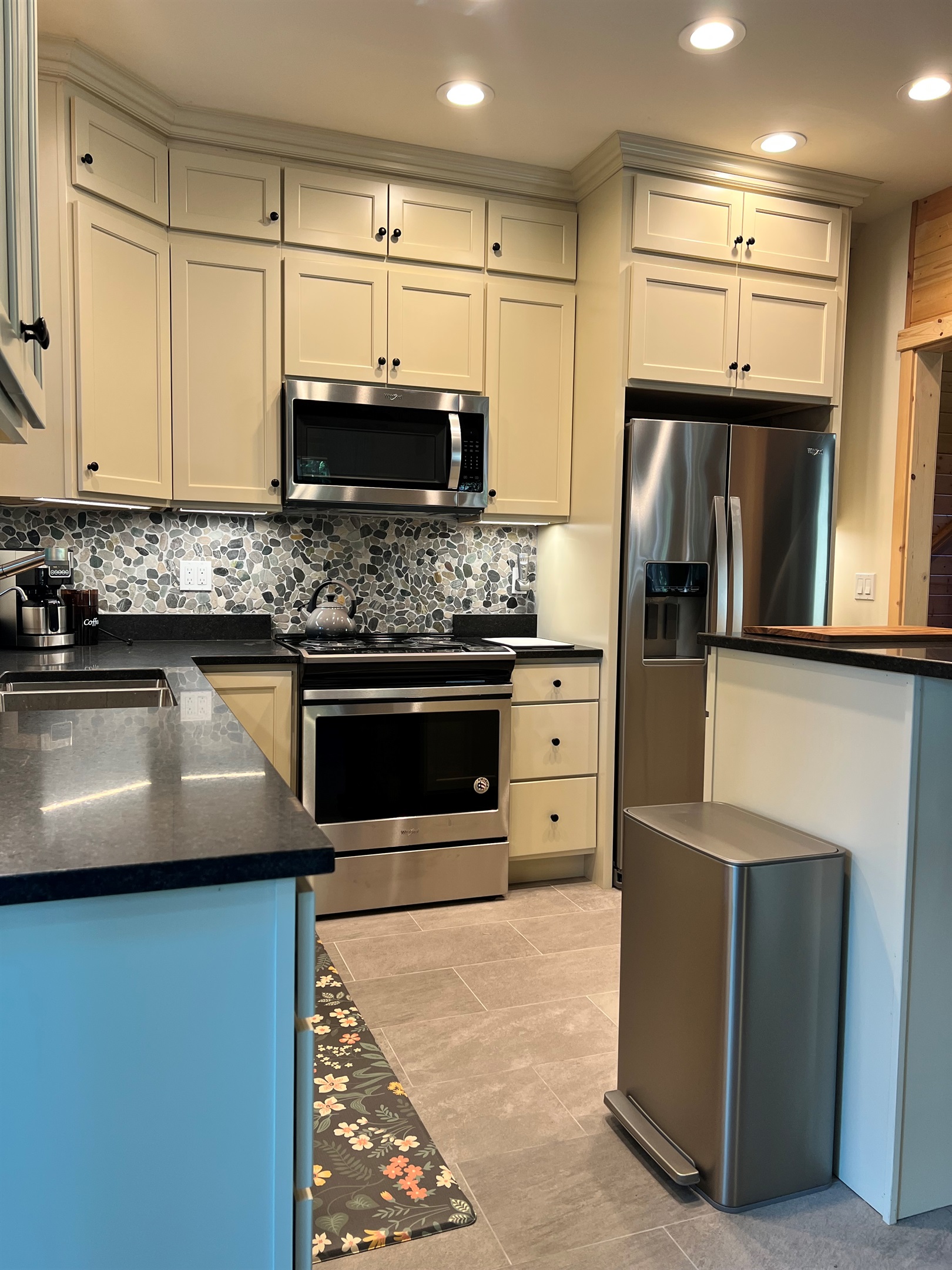 Warm and welcoming kitchen as part of great room allows everyone to gather together and visit in one large, open space.