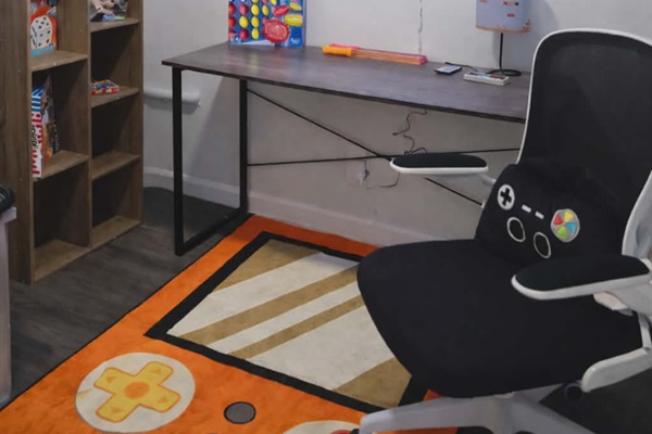 Find a desk in the game room for you to set up your favorite PC games, complete with a Nintendo style lamp and a shelf with plenty of board and card games to play!