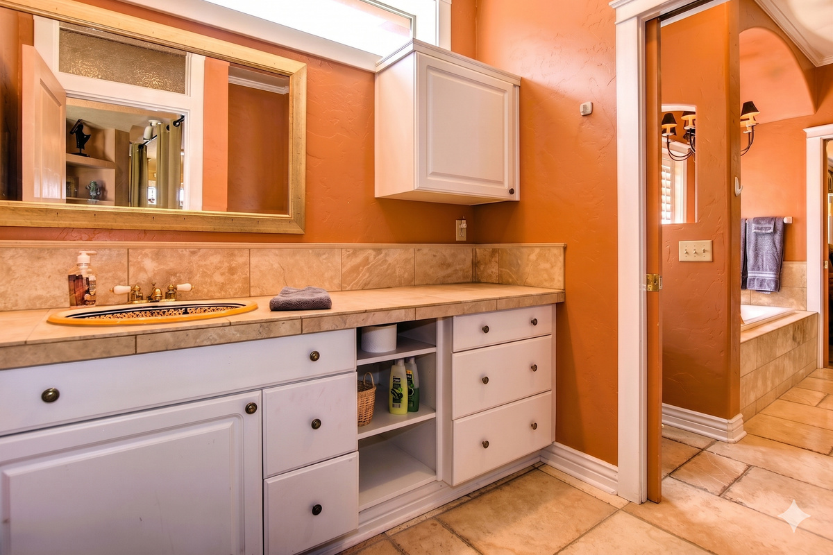 The secondary bathroom features ample counter space, ensuring comfort and functionality for all guests.