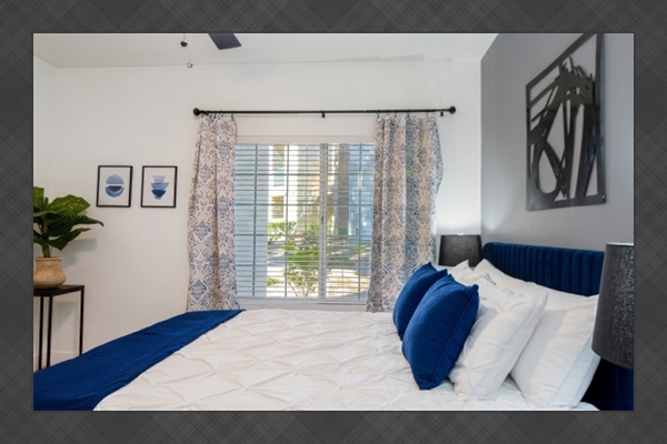 - Peaceful bedroom with plush bedding and calming tones for restful sleep   - Modern design with stylish lamps and soft natural light for cozy comfort   - Perfect blend of elegance and tranquility for a relaxing retreat