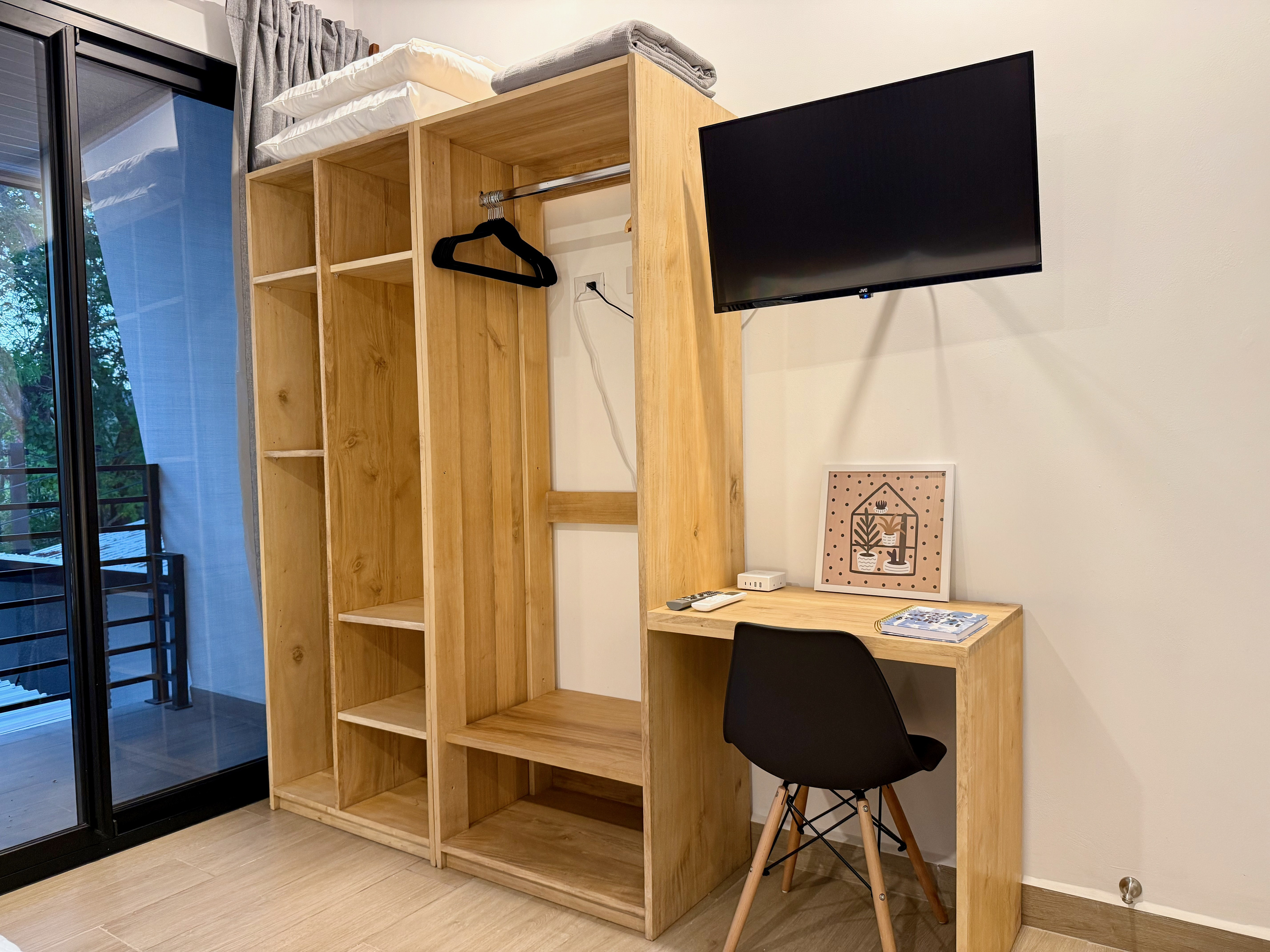 Wardrobe, workspace, TV.