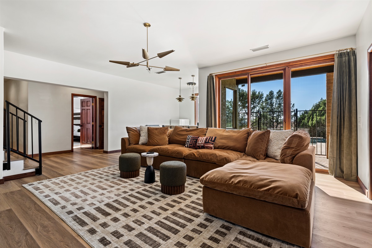 Spacious lounge with cozy seating and seamless indoor-outdoor flow.