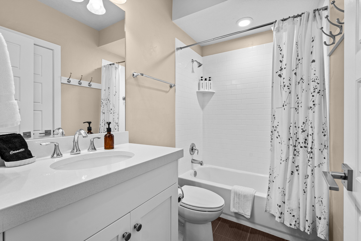 Downstairs full bathroom with clean, modern finishes.