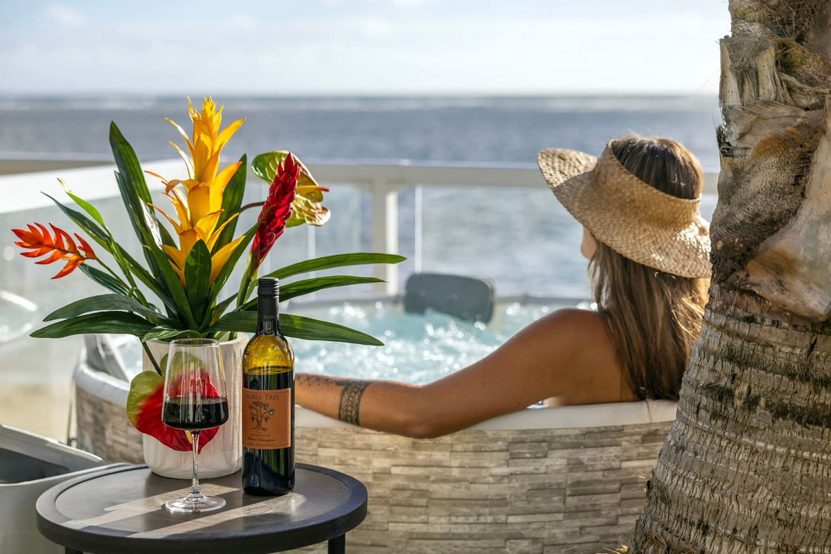 Chilling with a drink in home's third beachfront jacuzzi in your own private island
