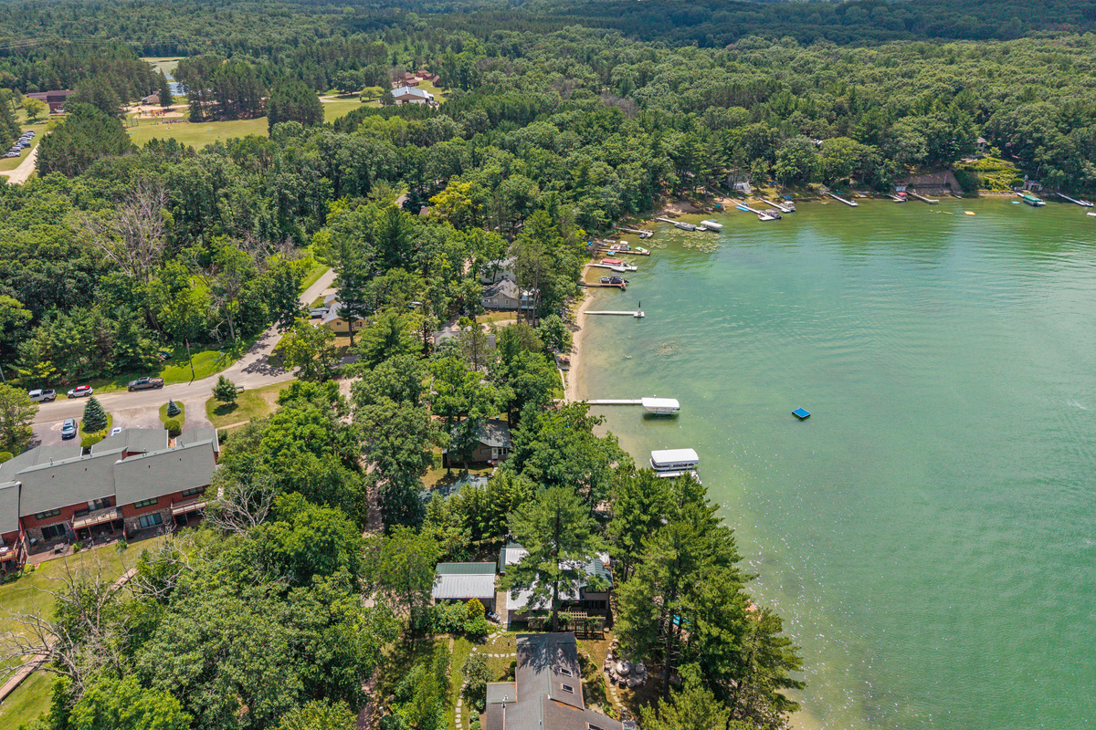 The serene beauty of the lake is even more breathtaking from above, offering a glimpse of the peaceful escape waiting for you.