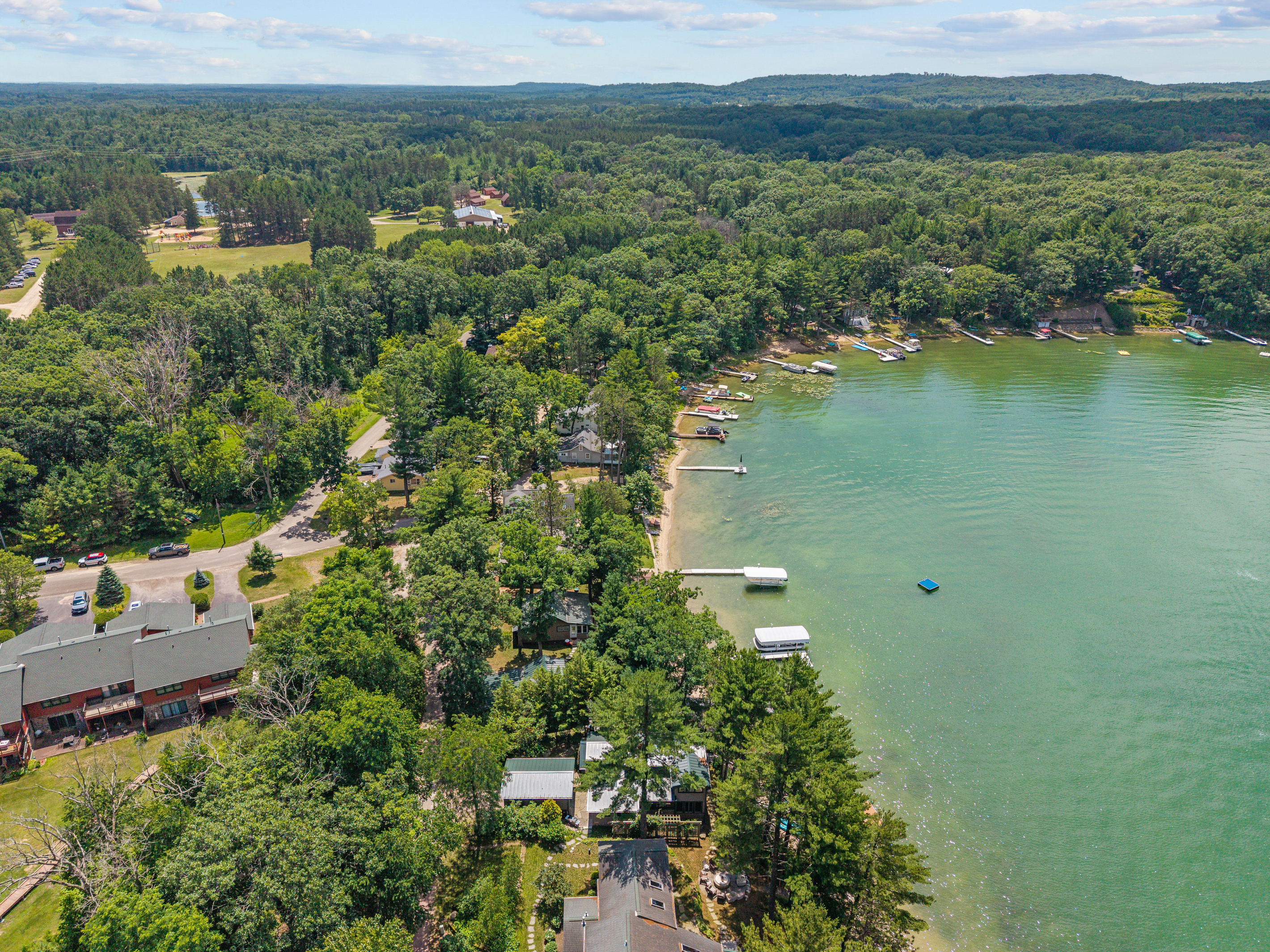 The serene beauty of the lake is even more breathtaking from above, offering a glimpse of the peaceful escape waiting for you.
