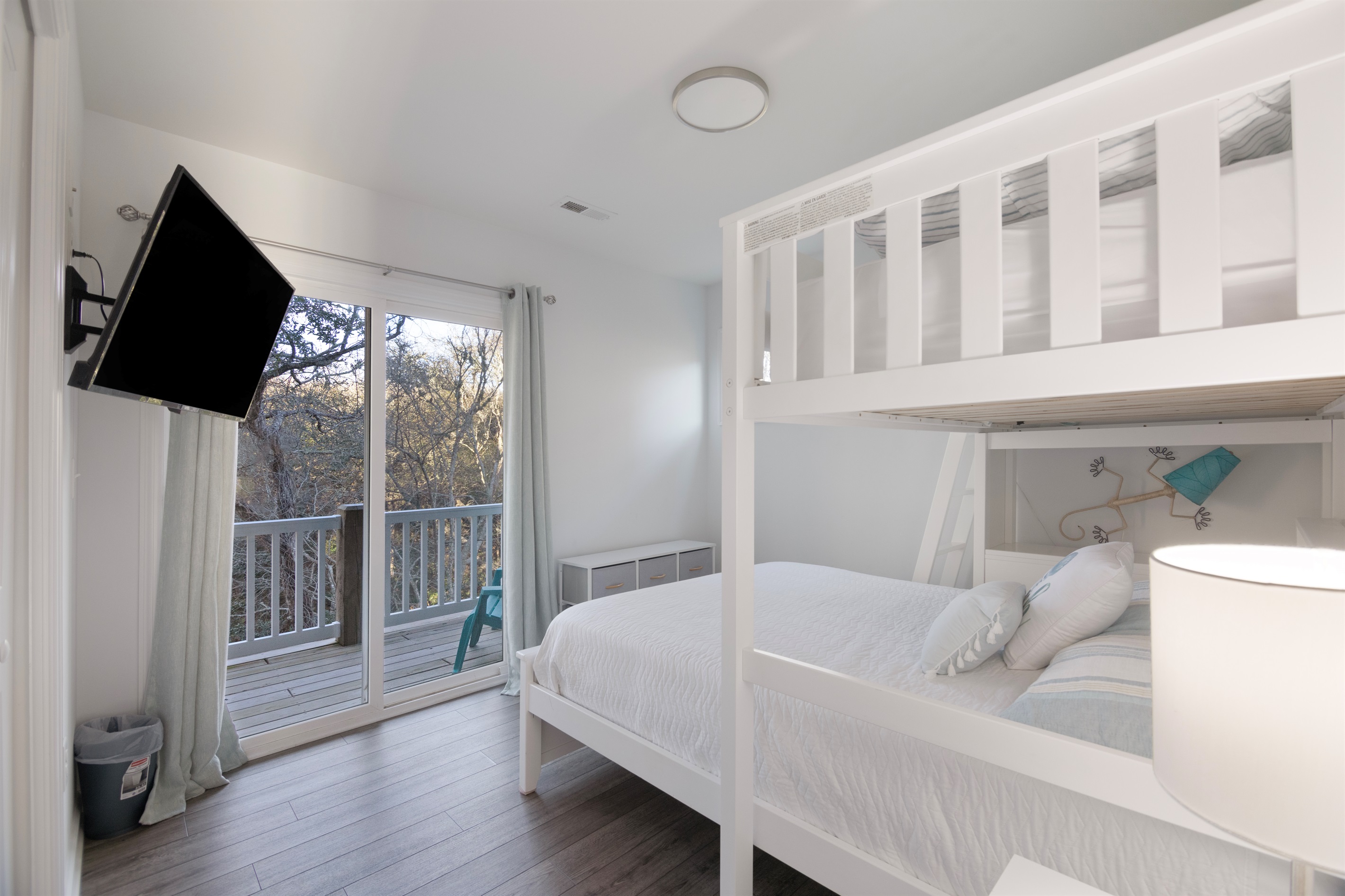 This bunk room is built for late-night cartoons and comfy sleep