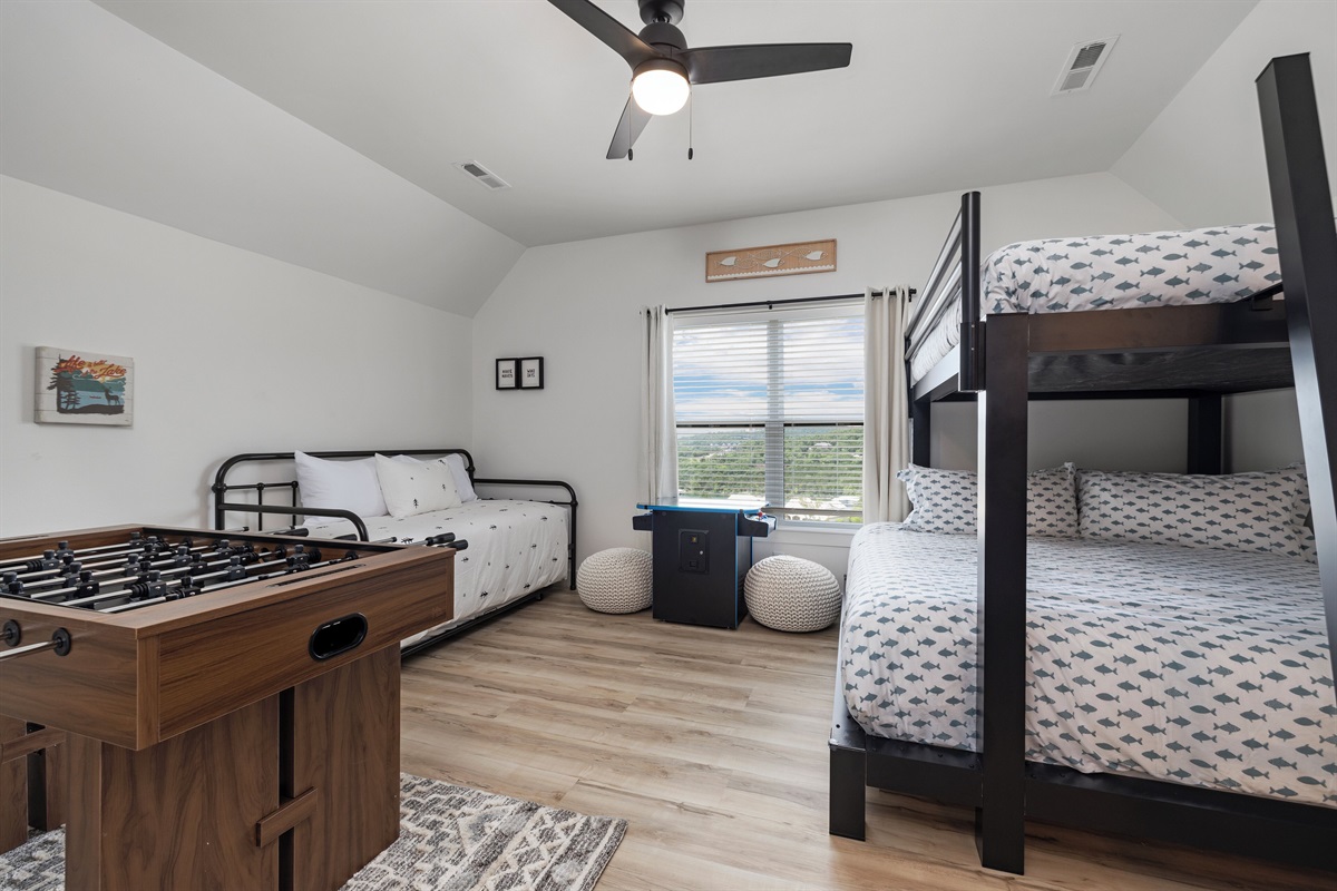 Upper Level Queen over King Bunk, daybed with trundle, multicade, foosball, TV