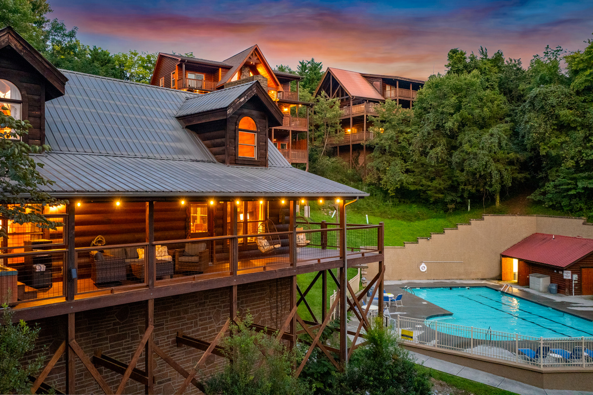 Enjoy the outdoors from the spacious covered deck featuring a private hot tub, comfortable conversational seating, and two cozy hanging basket chairs