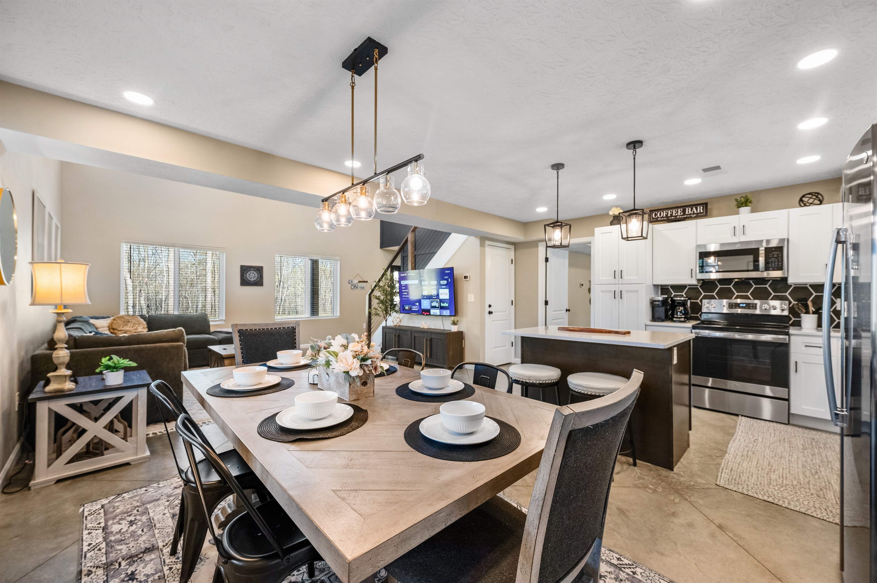 The open dining area flows seamlessly into the kitchen, creating the perfect space for gathering and shared meals.