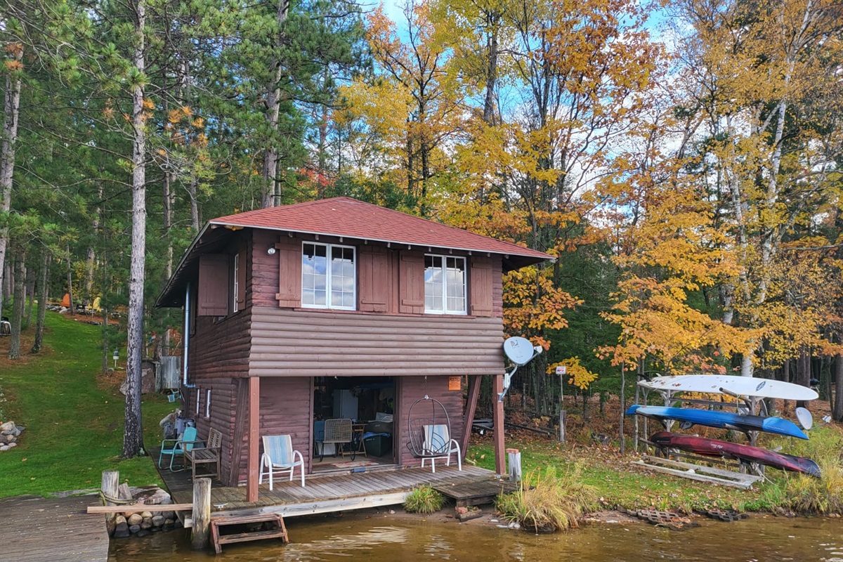 The boathouse surrounded by beautiful fall color. We provide 2 kayaks and a paddleboard to explore the lake