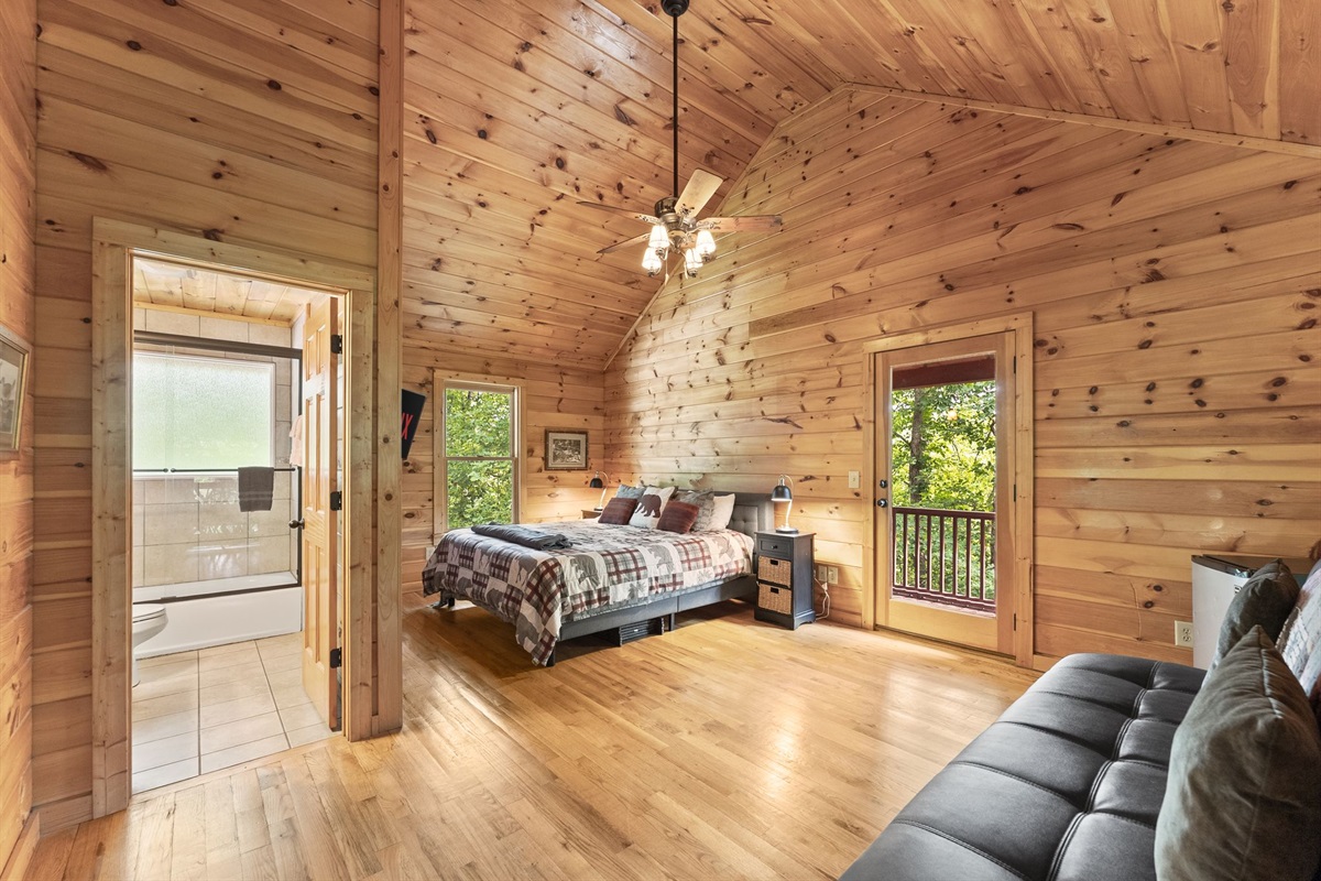 Open upstairs loft featuring a cozy king bed and full sleeper sofa &mdash; perfect for extra guests or a relaxing private retreat.