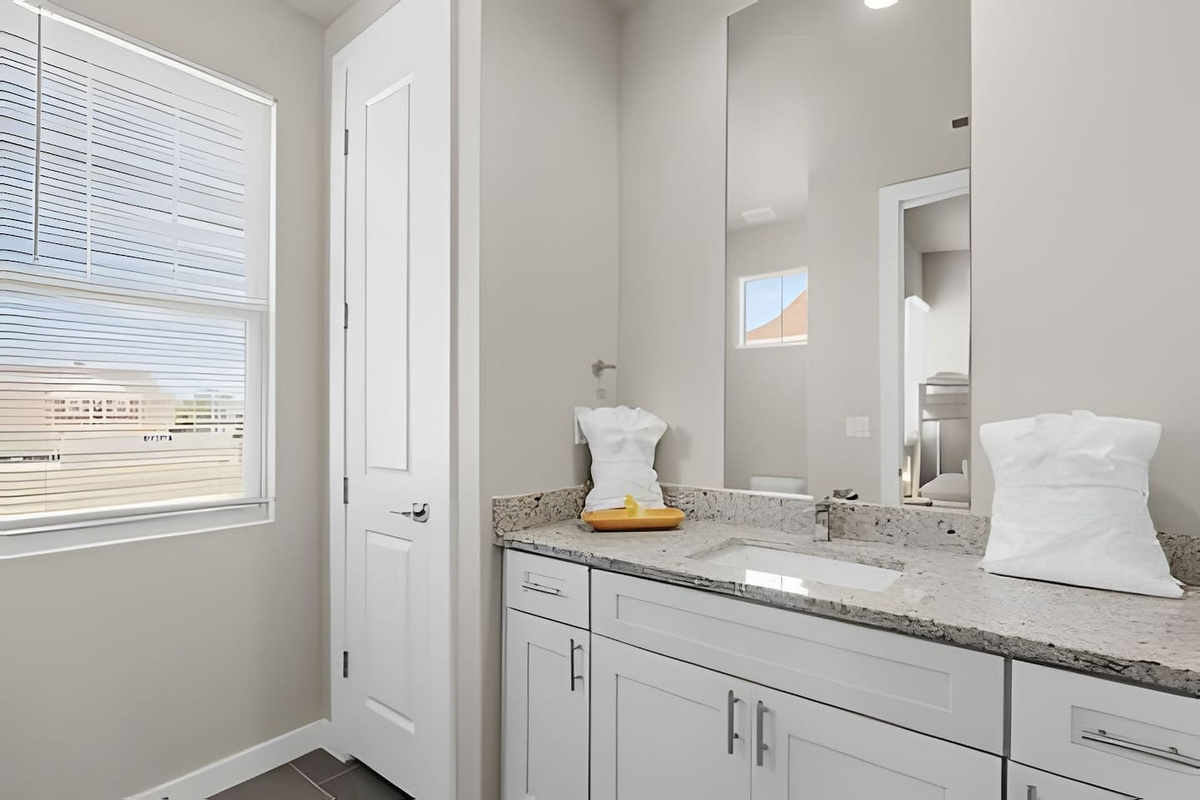 Modern and clean, this bathroom offers all the essentials for a refreshing start to your day.